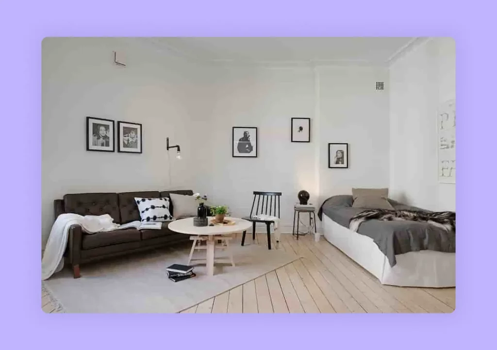 A minimalist guest room combining a sofa and a bed in one stylish space.