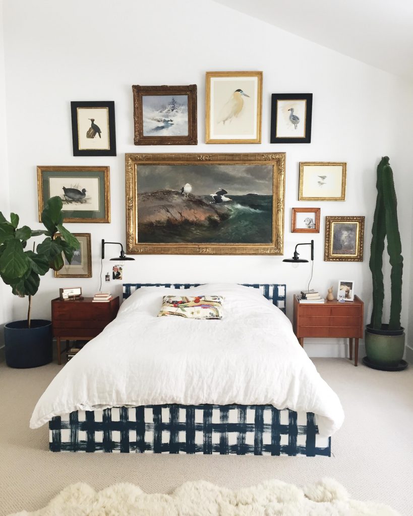 statement gallery wall in master bedroom