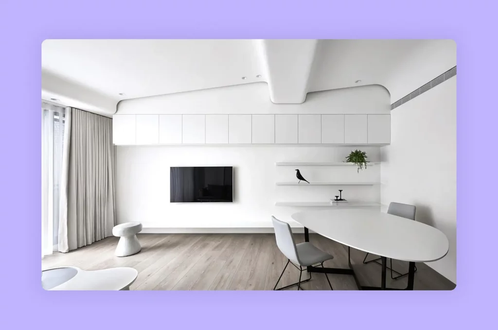 A minimalist all-white living and dining area, creating a sense of spaciousness and tranquility
