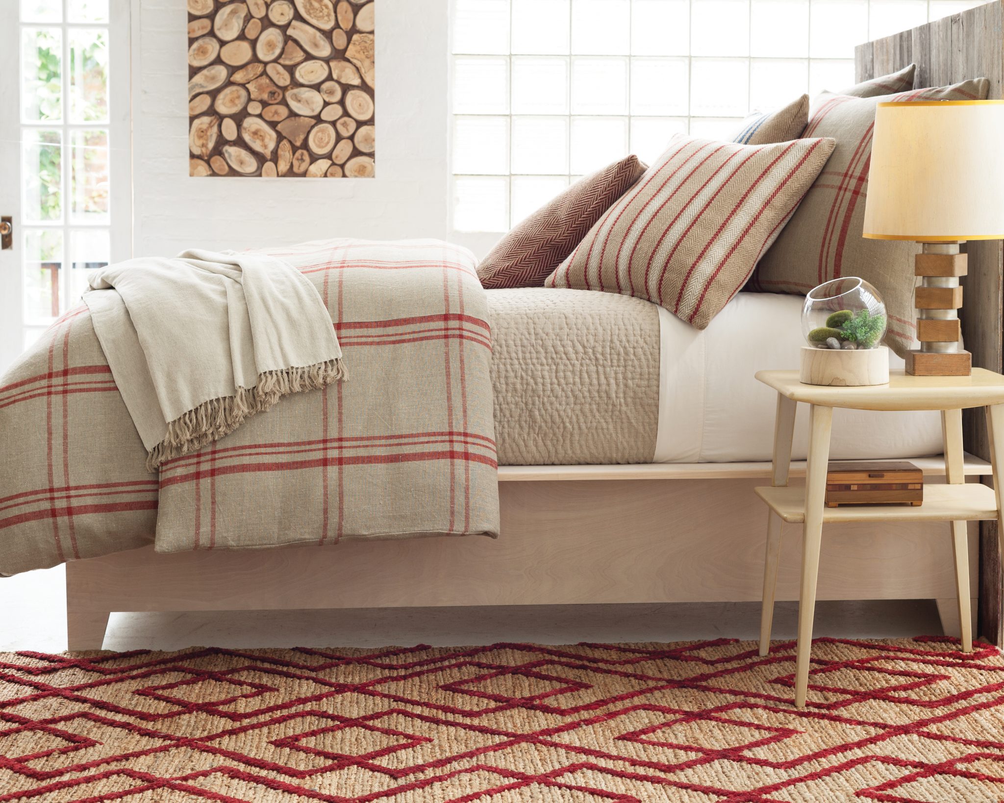 rustic bedroom with woven rugs