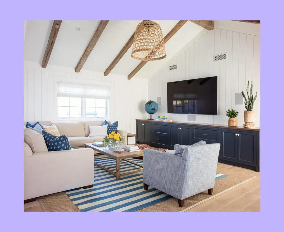 A well-designed living room with an interesting and unconventional furniture layout. 