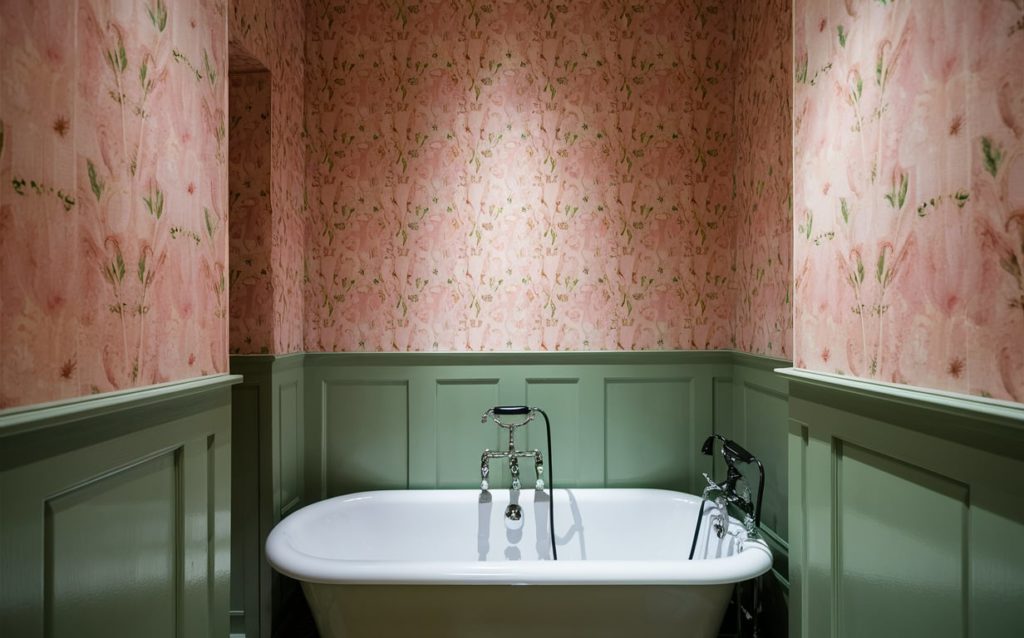 Soft blush pink, muted green, and crisp white bathroom paint colors
