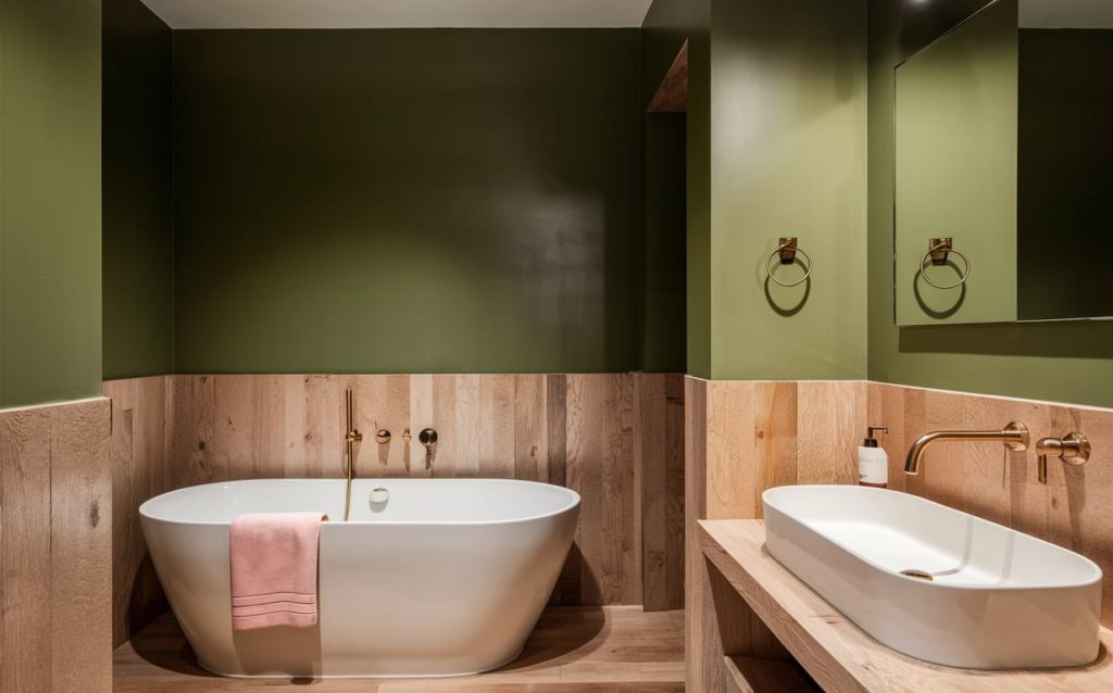 Spa-like bathroom featuring calming olive green and crisp white paint colors