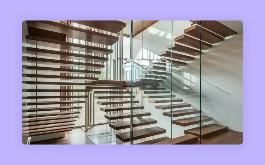 A modern glass staircase design featuring floating treads and glass railings. 