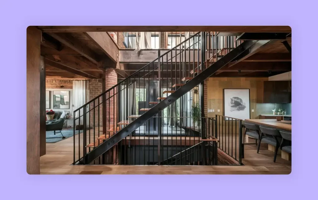 An outdoor staircase with metal railings in a rustic interior. 